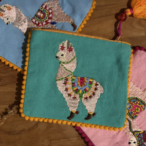 Pochette zippé bleu avec motif de lama brodé